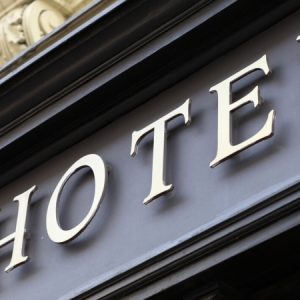 gold sign on exterior of hotel